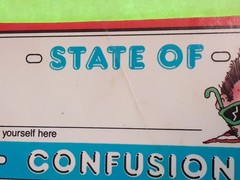 vintage 80’s Scholastic State of Confusion name tag sticker *damaged*