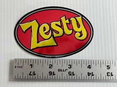 Vintage 2001 – «Zesty» – Shinny Holographic Oval Sticker (Measures 4 1/4 in)