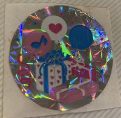 Vintage Sandylion 1980’s 1.5” circle prism sticker Birthday theme