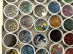 #1 – METAL CASE w/ 40 METAL CONTAINERS of SCRAPBOOKING EMBELLISHMENTS – EYELETS