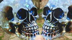 Pack of 2 – 4″ HOLOGRAPHIC Facing SKULLS Stickers BIG 4 inch skull STICKERS