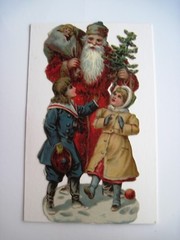 1800’s Large Christmas Die Cut w/ Santa Holding Small Tree & Boy & Girl *