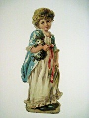 Adorable 1800’s Die Cut w/ Young Girl Carrying A Kitten w/ Princess Di Smile *