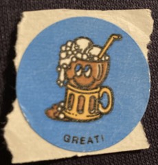 Vintage 1980’s matte 1.5” circle scratch n sniff root beer “Great” sticker