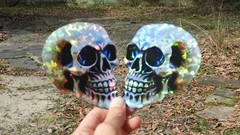 Pack of 2 – 4″ HOLOGRAPHIC Facing SKULLS Stickers BIG 4 inch skull STICKERS