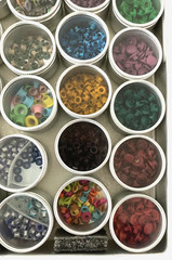 #1 – METAL CASE w/ 40 METAL CONTAINERS of SCRAPBOOKING EMBELLISHMENTS – EYELETS