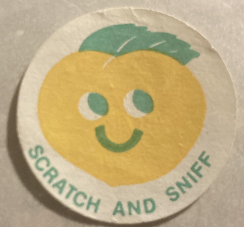 Vintage 1980’s 1.5” circle sticker matte scratch n sniff orange