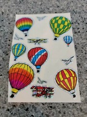 Vintage 80s Foil Stickers Prismatic Clowns Balloons airplanes flowers stick ons