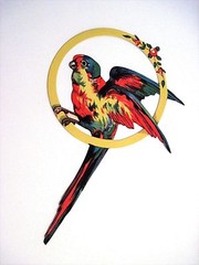 Large Vintage Die Cut of Gorgeous Colorful Parrot Sitting On Gold Ring *