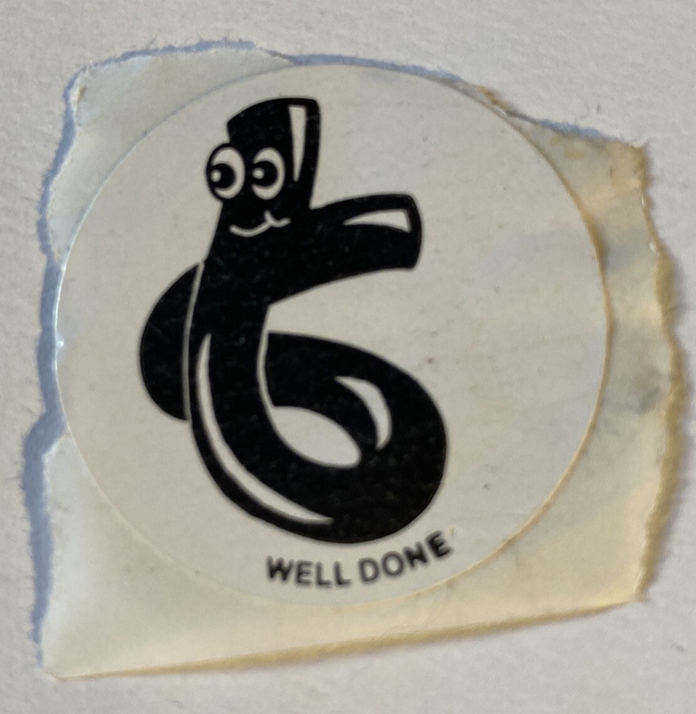 Vintage 1980’s 1.5” circle scratch n sniff black licorice sticker