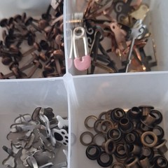 Scrapbooking Embellishments Lot Brads Eyelets in plastic storage box