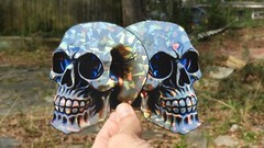 Pack of 2 – 4″ HOLOGRAPHIC Facing SKULLS Stickers BIG 4 inch skull STICKERS