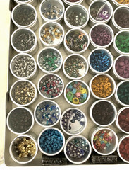 #1 – METAL CASE w/ 40 METAL CONTAINERS of SCRAPBOOKING EMBELLISHMENTS – EYELETS