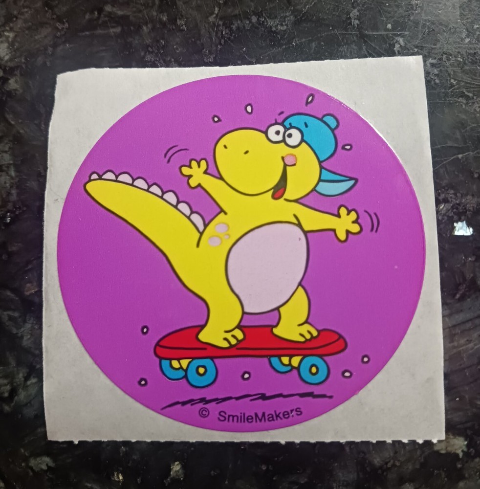 Vintage Sticker Smilemakers Dinosaur Riding A Skateboard 2.5″x2.5″