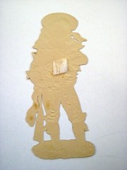 Lovely 1800’s Die Cut of Child Holding a Boat Filled w/ Pink & White Roses *
