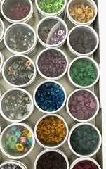 #1 – METAL CASE w/ 40 METAL CONTAINERS of SCRAPBOOKING EMBELLISHMENTS – EYELETS