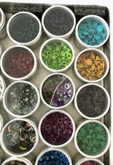 #1 – METAL CASE w/ 40 METAL CONTAINERS of SCRAPBOOKING EMBELLISHMENTS – EYELETS