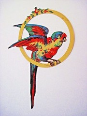 Large Vintage Die Cut of Gorgeous Colorful Parrot Sitting On Gold Ring *