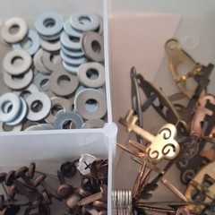 Scrapbooking Embellishments Lot Brads Eyelets in plastic storage box