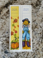 Set of two autumn-themed bookmarks with pumpkin and scarecrow designs