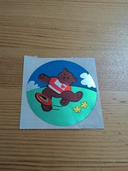 Vintage 1986 Sandylion large 3” circle prism sticker of Birthday bear & Frisbee