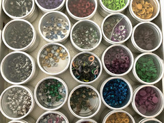 #1 – METAL CASE w/ 40 METAL CONTAINERS of SCRAPBOOKING EMBELLISHMENTS – EYELETS