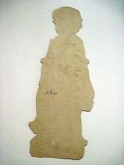 Adorable 1800’s Die Cut w/ Young Girl Carrying A Kitten w/ Princess Di Smile *
