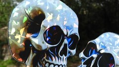 Pack of 2 – 4″ HOLOGRAPHIC Facing SKULLS Stickers BIG 4 inch skull STICKERS