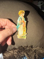 Adorable 1800’s Die Cut w/ Young Girl Carrying A Kitten w/ Princess Di Smile *