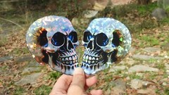 Pack of 2 – 4″ HOLOGRAPHIC Facing SKULLS Stickers BIG 4 inch skull STICKERS