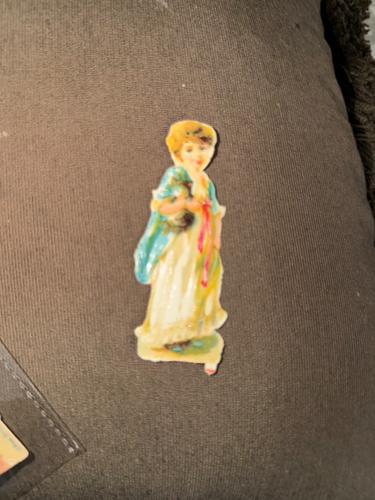 Adorable 1800’s Die Cut w/ Young Girl Carrying A Kitten w/ Princess Di Smile *