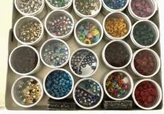 #1 – METAL CASE w/ 40 METAL CONTAINERS of SCRAPBOOKING EMBELLISHMENTS – EYELETS
