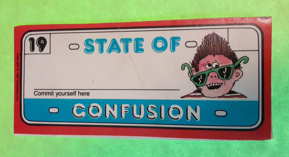 vintage 80’s Scholastic State of Confusion name tag sticker *damaged*