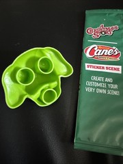Raising Cane’s A Christmas Story Sticker Scene Pack + Green Doggie Finger Puppet